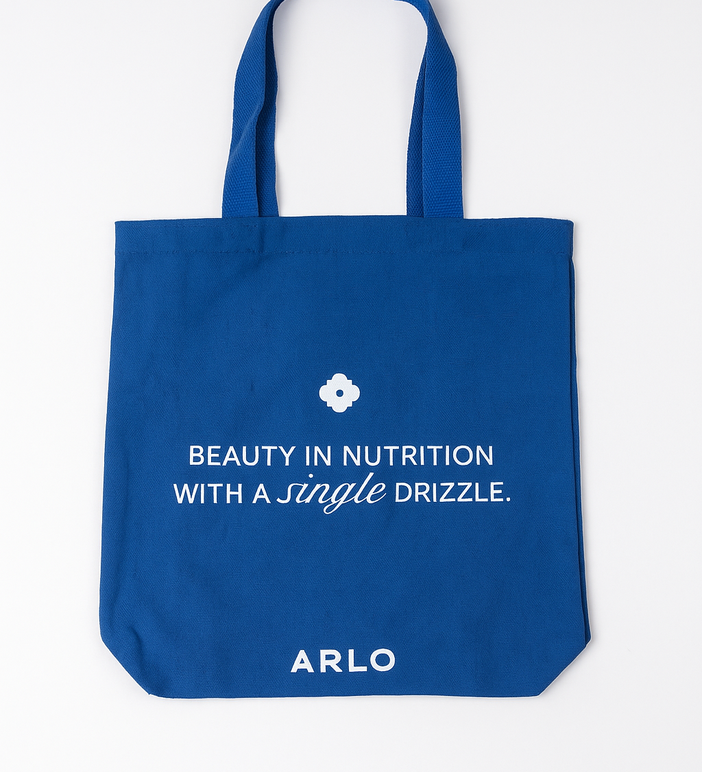 ARLO blue tote bag – Beauty in Nutrition with a single drizzle. Reusable cotton grocery bag, front with white branding