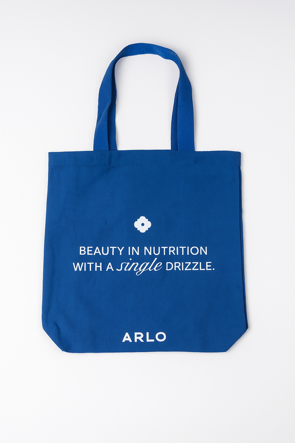 ARLO blue tote bag – Beauty in Nutrition with a single drizzle. Reusable cotton grocery bag, front with white branding