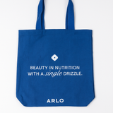 ARLO blue tote bag – Beauty in Nutrition with a single drizzle. Reusable cotton grocery bag, front with white branding