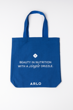 ARLO blue tote bag – Beauty in Nutrition with a single drizzle. Reusable cotton grocery bag, front with white branding
