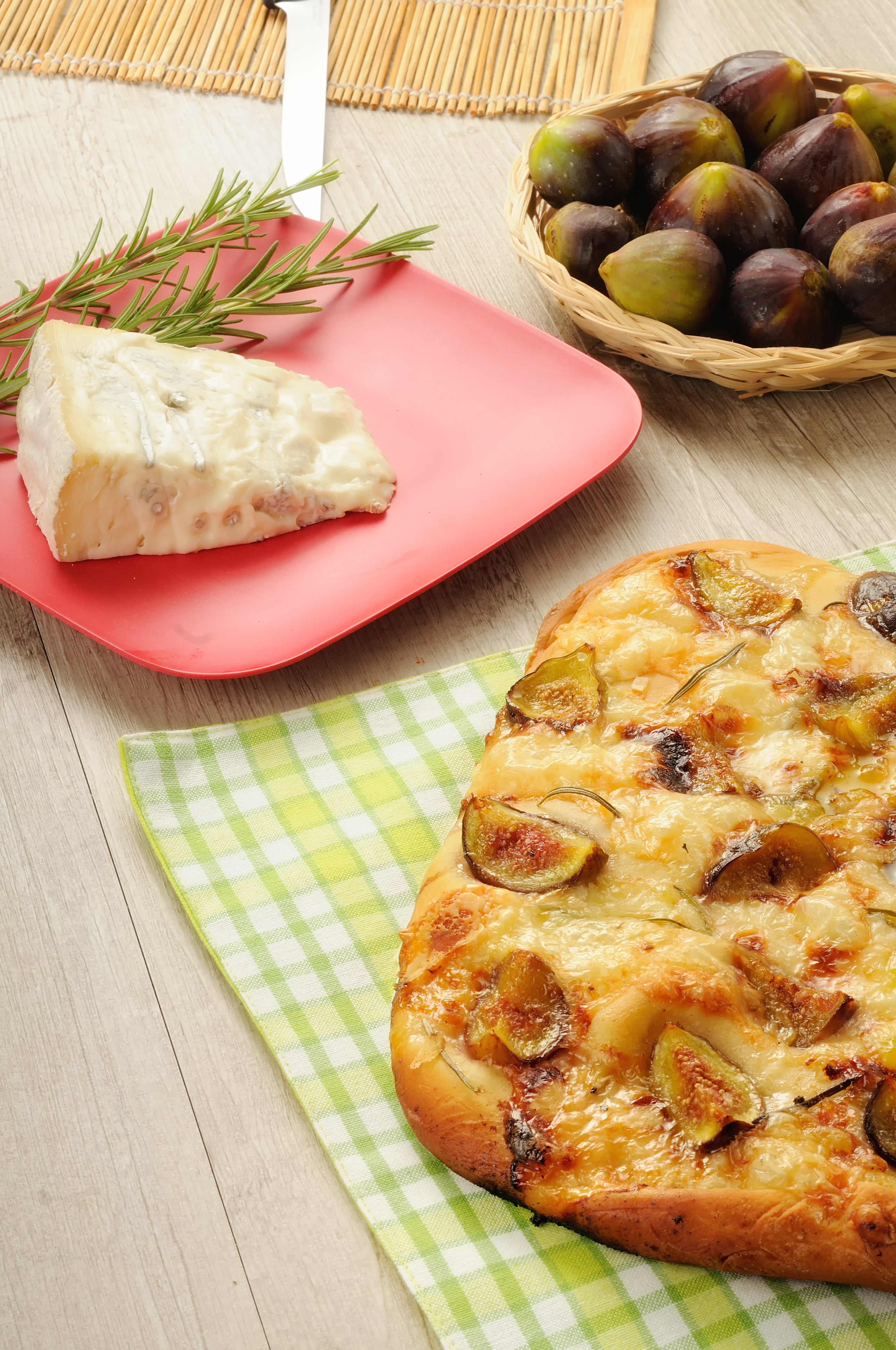 Focaccia topped with fresh figs, Gorgonzola cheese, and rosemary, baked golden and finished with ARLO culinary argan oil