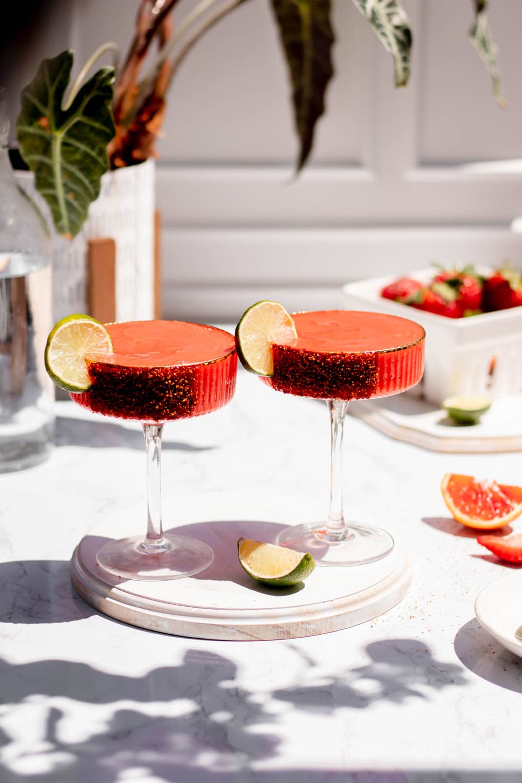 Frozen blood orange margarita with chili-salt rim and lime, featuring ARLO culinary argan oil for a silky summer cocktail