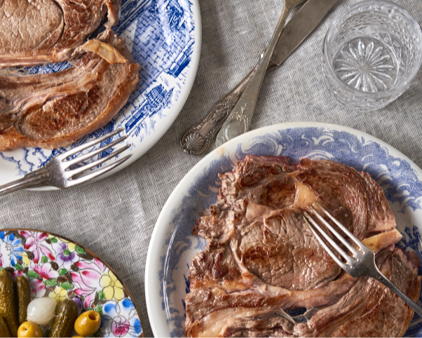 Grilled ribeye steak with pickled vegetable salad, finished with ARLO culinary argan oil for a rich, flavorful main course