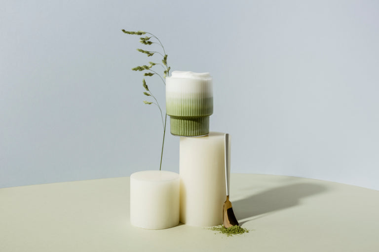 Ceremonial matcha latte with creamy milk and ARLO culinary argan oil, presented with a minimal, modern aesthetic