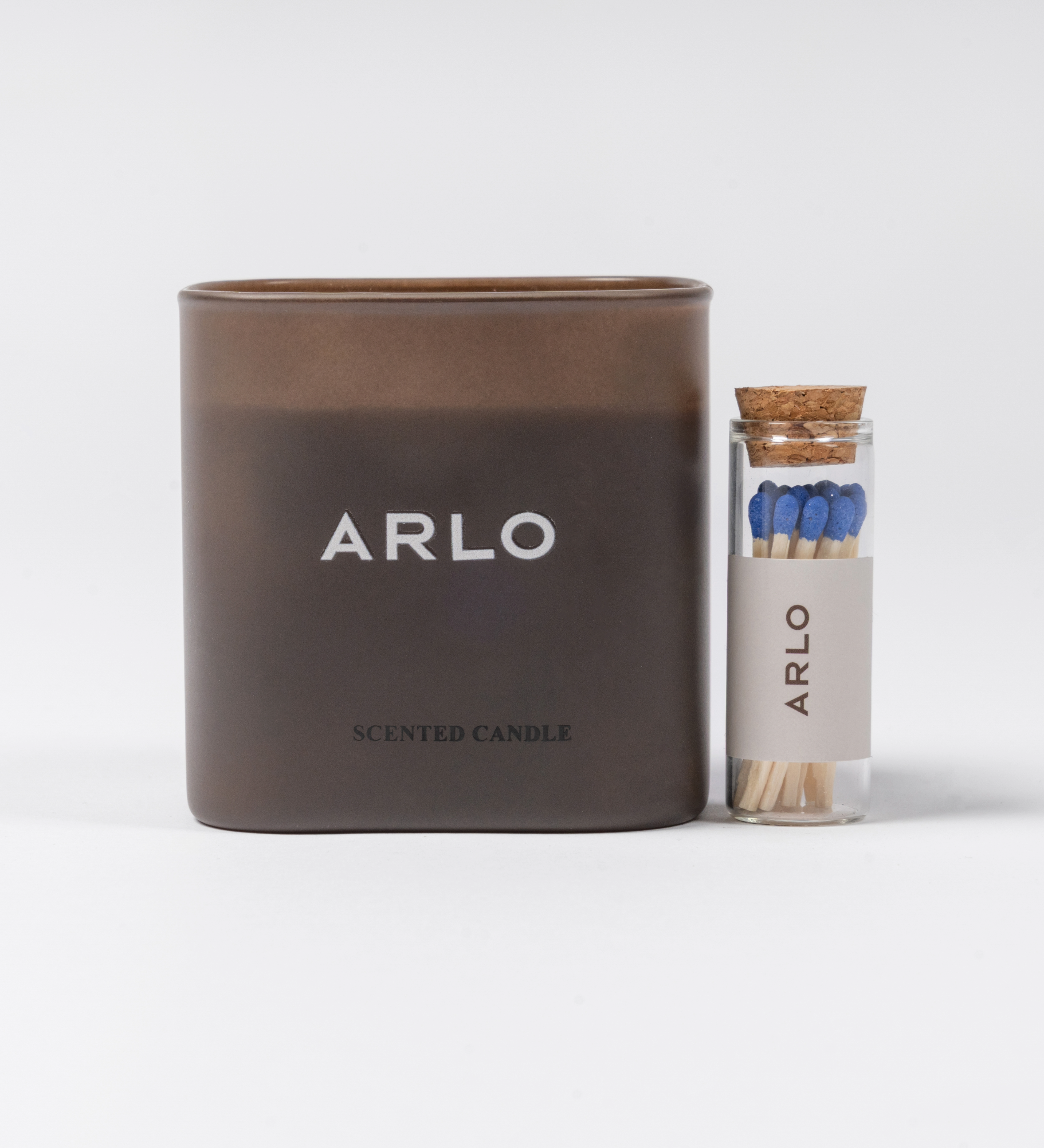 ARLO scented candle set – brown glass candle and branded matches, front view, luxury gift