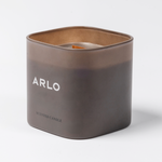 ARLO scented candle – brown glass, side angle showing white logo, premium home scent