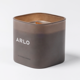 ARLO scented candle – brown glass, side angle showing white logo, premium home scent