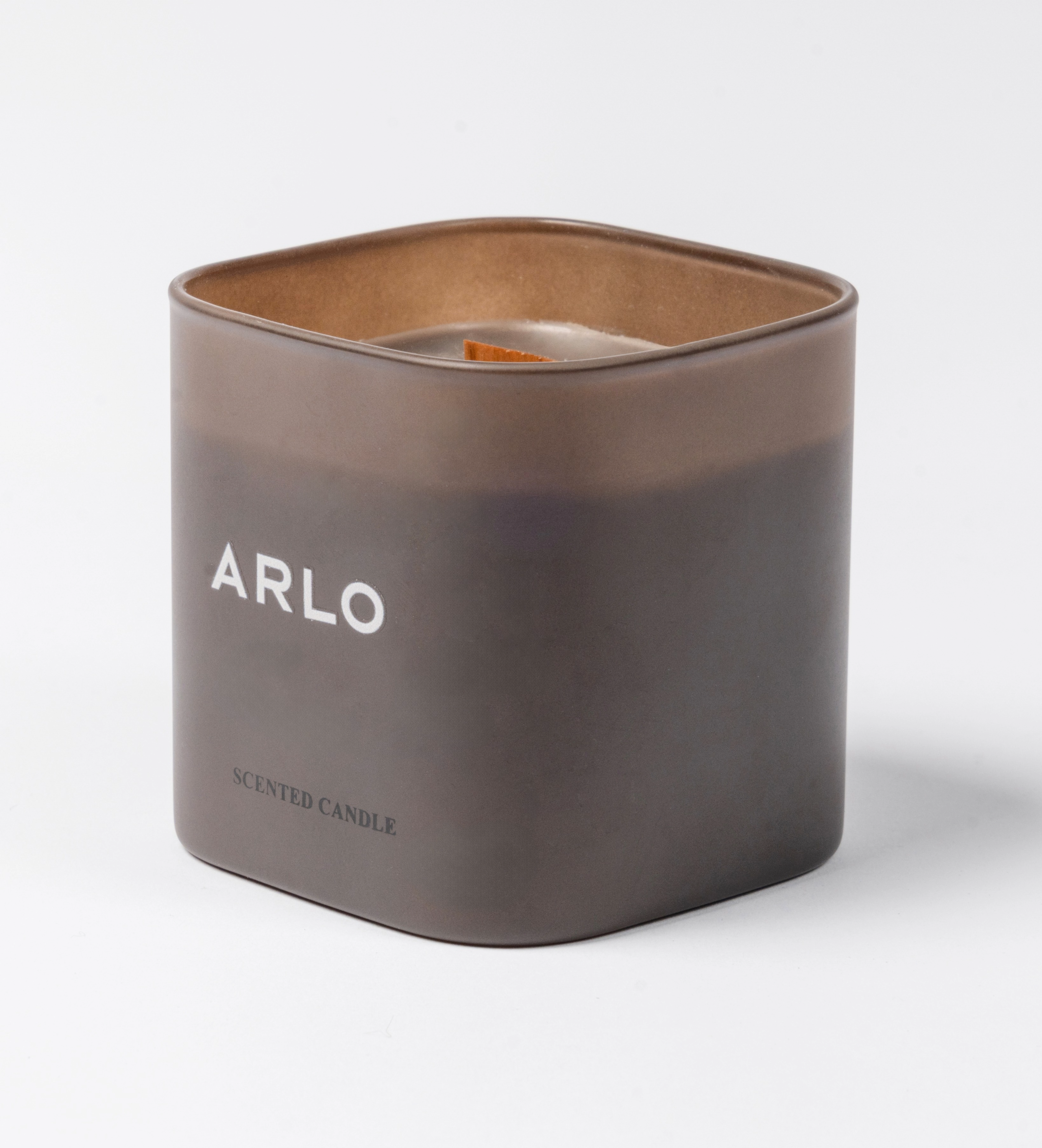 ARLO scented candle – brown glass, side angle showing white logo, premium home scent